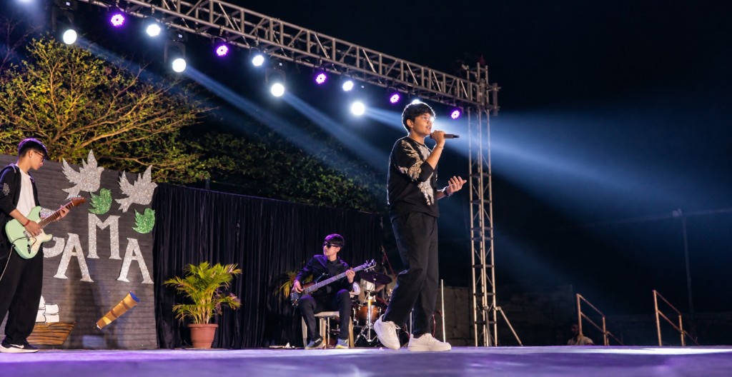 Student band performing live on stage at TACS