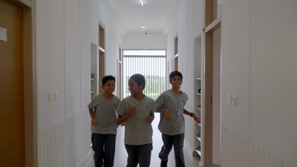 Students in the hostel corridors at TACS