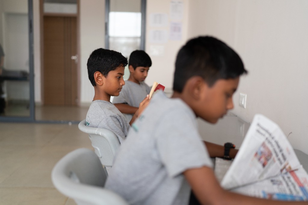 Students reading in the campus library at TACS