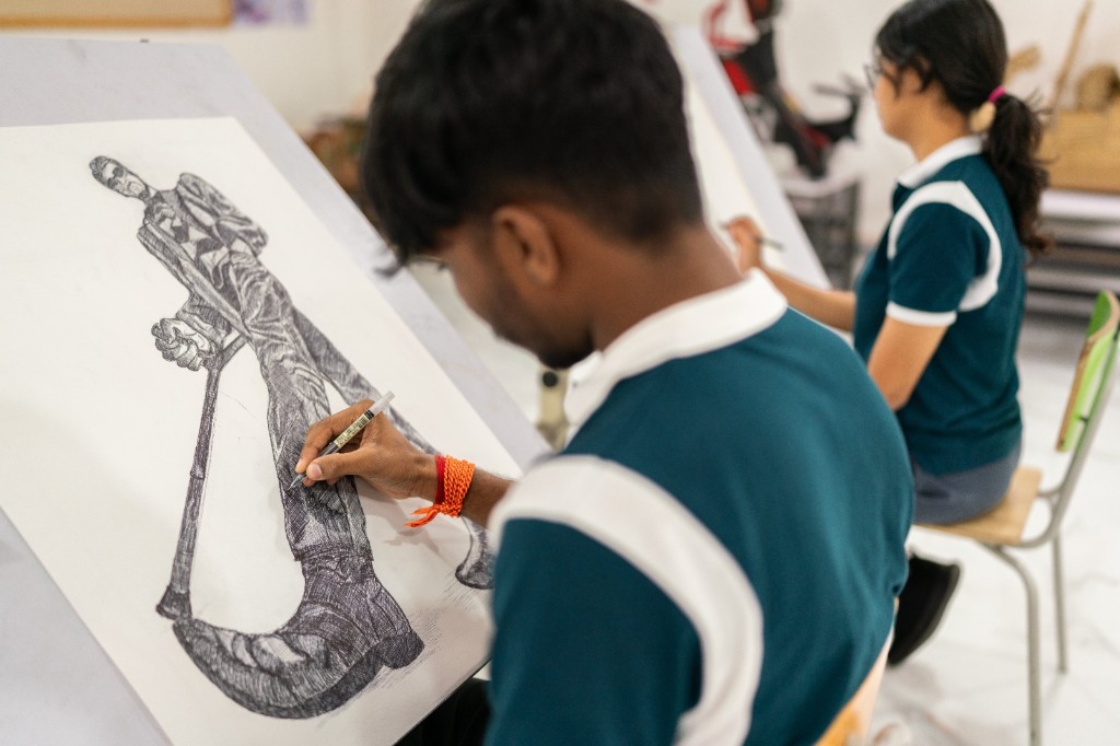 Students sketching during an art and craft session at TACS